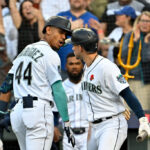 SEATTLE, WASHINGTON - MAY 29: Julio Rodriguez #44 shakes hands with Jarred Kelenic #10 of the Seattle Mariners after hitting a one-run home run during the fourth inning against the New York Yankees at T-Mobile Park on May 29, 2023 in Seattle, Washington. (Photo by Alika Jenner/Getty Images)