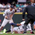 SEATTLE, WASHINGTON - MAY 31: Julio Rodriguez #44 of the Seattle Mariners steals second base against Gleyber Torres #25 of the New York Yankees during the fourth inning at T-Mobile Park on May 31, 2023 in Seattle, Washington. (Photo by Steph Chambers/Getty Images)