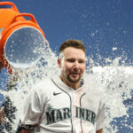 SEATTLE, WASHINGTON - MAY 31: Cal Raleigh #29 of the Seattle Mariners is doused with water after his walk-off single during the tenth inning against the New York Yankees at T-Mobile Park on May 31, 2023 in Seattle, Washington. (Photo by Steph Chambers/Getty Images)