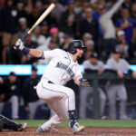 SEATTLE, WASHINGTON - MAY 31: Cal Raleigh #29 of the Seattle Mariners watches his walk-off single during the tenth inning against the New York Yankees at T-Mobile Park on May 31, 2023 in Seattle, Washington. (Photo by Steph Chambers/Getty Images)