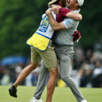 TORONTO, ONTARIO - JUNE 11:  Nick Taylor of Canada celebrates with his caddie after making an eagle putt on the 4th playoff hole to win the RBC Canadian Open at Oakdale Golf & Country Club on June 11, 2023 in Toronto, Ontario. (Photo by Minas Panagiotakis/Getty Images)