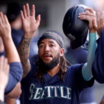 SEATTLE, WASHINGTON - JUNE 12: J.P. Crawford #3 of the Seattle Mariners celebrates a run against the Miami Marlins during the first inning at T-Mobile Park on June 12, 2023 in Seattle, Washington. (Photo by Steph Chambers/Getty Images)