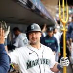 SEATTLE, WASHINGTON - JUNE 13: Cal Raleigh #29 of the Seattle Mariners celebrates his three run home run with the team's celebration trident during the second inning against the Miami Marlins at T-Mobile Park on June 13, 2023 in Seattle, Washington. (Photo by Steph Chambers/Getty Images)