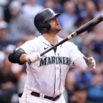 SEATTLE, WASHINGTON - JUNE 13: Mike Ford #20 of the Seattle Mariners watches his two run home run during the fourth inning against the Miami Marlins at T-Mobile Park on June 13, 2023 in Seattle, Washington. (Photo by Steph Chambers/Getty Images)