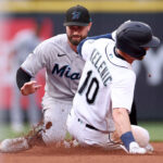 SEATTLE, WASHINGTON - JUNE 13: Jarred Kelenic #10 of the Seattle Mariners steals second base against Jon Berti #5 of the Miami Marlins during the fourth inning at T-Mobile Park on June 13, 2023 in Seattle, Washington. (Photo by Steph Chambers/Getty Images)