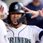 SEATTLE, WASHINGTON - JUNE 13: Eugenio Suarez #28 of the Seattle Mariners celebrates a run during the sixth inning against the Miami Marlins at T-Mobile Park on June 13, 2023 in Seattle, Washington. (Photo by Steph Chambers/Getty Images)