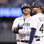 SEATTLE, WASHINGTON - JUNE 13: Mike Ford #20 of the Seattle Mariners reacts after his single during the sixth inning against the Miami Marlins at T-Mobile Park on June 13, 2023 in Seattle, Washington. (Photo by Steph Chambers/Getty Images)
