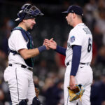 SEATTLE, WASHINGTON - JUNE 13: Cal Raleigh #29 and Tayler Saucedo #60 of the Seattle Mariners celebrate their 9-3 win against the Miami Marlins at T-Mobile Park on June 13, 2023 in Seattle, Washington. (Photo by Steph Chambers/Getty Images)