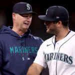 SEATTLE, WASHINGTON - JUNE 13: Manager Scott Servais #9 and Mike Ford #20 of the Seattle Mariners celebrate their win against the Miami Marlins at T-Mobile Park on June 13, 2023 in Seattle, Washington. (Photo by Steph Chambers/Getty Images)