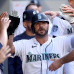 SEATTLE, WASHINGTON - JUNE 26: Mike Ford #20 of the Seattle Mariners celebrates a run against the Washington Nationals during the fifth inning at T-Mobile Park on June 26, 2023 in Seattle, Washington. (Photo by Steph Chambers/Getty Images)
