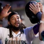 SEATTLE, WASHINGTON - JUNE 26: J.P. Crawford #3 of the Seattle Mariners celebrates a run during the eighth inning against the Washington Nationals at T-Mobile Park on June 26, 2023 in Seattle, Washington. (Photo by Steph Chambers/Getty Images)