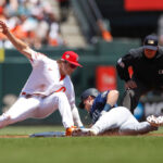 SAN FRANCISCO, CALIFORNIA - JULY 4: Jarred Kelenic #10 of the Seattle Mariners is tagged out by Casey Schmitt #6 of the San Francisco Giants during a stolen base attempt in the first inning at Oracle Park on July 04, 2023 in San Francisco, California. (Photo by Brandon Sloter/Getty Images)