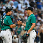 SEATTLE, WASHINGTON - JULY 01: Cal Raleigh (L) #29 and Paul Sewald #37 of the Seattle Mariners shake hands after a 8-3 win against the Tampa Bay Rays at T-Mobile Park on July 01, 2023 in Seattle, Washington. (Photo by Alika Jenner/Getty Images)