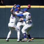 SEATTLE, WASHINGTON - JULY 02: Jarred Kelenic #10, Julio Rodriguez #44 and Teoscar Hernandez #35 of the Seattle Mariners celebrate their 7-6 win against the Tampa Bay Rays at T-Mobile Park on July 02, 2023 in Seattle, Washington. (Photo by Steph Chambers/Getty Images)