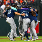 HOUSTON, TEXAS - JULY 06: The Seattle Mariners celebrate in the infield after defeating the Houston Astros at Minute Maid Park on July 06, 2023 in Houston, Texas. (Photo by Logan Riely/Getty Images)