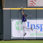 HOUSTON, TEXAS - JULY 07:Julio Rodriguez #44 of the Seattle Mariners makes a leaping catch at the wall on a fl ball by David Hensley #17 of the Houston Astros in the ninth inning at Minute Maid Park on July 07, 2023 in Houston, Texas. (Photo by Bob Levey/Getty Images)
