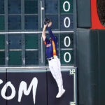 HOUSTON, TEXAS - JULY 09: Chas McCormick #20 of the Houston Astros makes a leaping catch at the wall on a fly ball by Teoscar Hernandez #35 of the Seattle Mariners in the second inning at Minute Maid Park on July 09, 2023 in Houston, Texas. (Photo by Bob Levey/Getty Images)