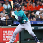 HOUSTON, TEXAS - JULY 09: Ty France #23 of the Seattle Mariners is hit by a pitch in the fourth inning against the Houston Astros at Minute Maid Park on July 09, 2023 in Houston, Texas. (Photo by Bob Levey/Getty Images)
