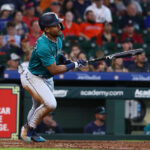 HOUSTON, TEXAS - JULY 09: Julio Rodriguez #44 of the Seattle Mariners singles in the eighth inning against the Houston Astros at Minute Maid Park on July 09, 2023 in Houston, Texas. (Photo by Bob Levey/Getty Images)