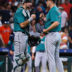 HOUSTON, TEXAS - JULY 09: Paul Sewald #37 of the Seattle Mariners and Cal Raleigh #29 celebrate after defeating the Houston Astros 3-1 at Minute Maid Park on July 09, 2023 in Houston, Texas. (Photo by Bob Levey/Getty Images)