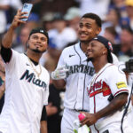 SEATTLE, WASHINGTON - JULY 10: Luis Arraez #3 of the Miami Marlins takes a selfie with Ozzie Albies #1 of the Atlanta Braves and Julio Rodríguez #44 of the Seattle Mariners during the T-Mobile Home Run Derby at T-Mobile Park on July 10, 2023 in Seattle, Washington. (Photo by Tim Nwachukwu/Getty Images)