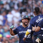 SEATTLE, WASHINGTON - JULY 11: Elias Díaz #35 of the Colorado Rockies celebrates with teammates after hitting a home run in the eight inning during the 93rd MLB All-Star Game presented by Mastercard at T-Mobile Park on July 11, 2023 in Seattle, Washington. (Photo by Steph Chambers/Getty Images)