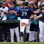 SEATTLE, WASHINGTON - JULY 17: Cal Raleigh #29 of the Seattle Mariners scores a run during the sixth inning against the Minnesota Twins at T-Mobile Park on July 17, 2023 in Seattle, Washington. (Photo by Steph Chambers/Getty Images)