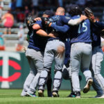 MINNEAPOLIS, MINNESOTA - JULY 26:  The Seattle Mariners celebrate by dancing after defeating the Minnesota Twins 8-7 at Target Field on July 26, 2023 in Minneapolis, Minnesota.  (Photo by Adam Bettcher/Getty Images)