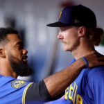 SEATTLE, WASHINGTON - JULY 21: Teoscar Hernandez #35 consoles Bryce Miller #50 of the Seattle Mariners during the sixth inning against the Toronto Blue Jays at T-Mobile Park on July 21, 2023 in Seattle, Washington. (Photo by Steph Chambers/Getty Images)
