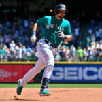 SEATTLE, WASHINGTON - JULY 22: Cal Raleigh #29 of the Seattle Mariners rounds the bases after hitting a solo home run during the third inning against the Toronto Blue Jays at T-Mobile Park on July 22, 2023 in Seattle, Washington. (Photo by Alika Jenner/Getty Images)