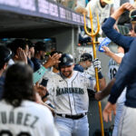 SEATTLE, WASHINGTON - JULY 31: Cal Raleigh #29 of the Seattle Mariners celebrates with teammates in the dugout after hitting a solo home run during the seventh inning against the Boston Red Sox at T-Mobile Park on July 31, 2023 in Seattle, Washington. (Photo by Alika Jenner/Getty Images)