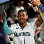 SEATTLE, WASHINGTON - JULY 31: Julio Rodriguez #44 of the Seattle Mariners celebrates with teammates after scoring during the eighth inning against the Boston Red Sox at T-Mobile Park on July 31, 2023 in Seattle, Washington. (Photo by Alika Jenner/Getty Images)