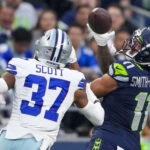 Seattle Seahawks wide receiver Jaxon Smith-Njigba catches a pass in front of Dallas Cowboys cornerback Eric Scott Jr. during the first half of a preseason NFL football game Saturday, Aug. 19, 2023, in Seattle. (AP Photo/Lindsey Wasson)Credit: ASSOCIATED PRESS