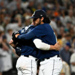 SEATTLE, WASHINGTON - AUGUST 08: Andres Munoz #75 of the Seattle Mariners and Tom Murphy #2 hug after the game against the San Diego Padres at T-Mobile Park on August 08, 2023 in Seattle, Washington. The Seattle Mariners won 2-0. (Photo by Alika Jenner/Getty Images)