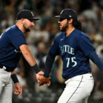 SEATTLE, WASHINGTON - AUGUST 08: Andres Munoz #75 of the Seattle Mariners and Cal Raleigh #29 celebrate after the game against the San Diego Padres at T-Mobile Park on August 08, 2023 in Seattle, Washington. The Seattle Mariners won 2-0. (Photo by Alika Jenner/Getty Images)