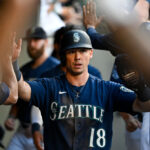 SEATTLE, WASHINGTON - AUGUST 09: Cade Marlowe #18 of the Seattle Mariners celebrates with teammates in the dugout after scoring during the third inning against the San Diego Padres at T-Mobile Park on August 09, 2023 in Seattle, Washington. (Photo by Alika Jenner/Getty Images)