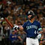 SEATTLE, WASHINGTON - AUGUST 09: Julio Rodriguez #44 of the Seattle Mariners tosses his bat after taking base on balls during the eighth inning against the San Diego Padres at T-Mobile Park on August 09, 2023 in Seattle, Washington. (Photo by Alika Jenner/Getty Images)