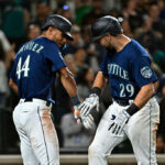 SEATTLE, WASHINGTON - AUGUST 09: Cal Raleigh #29 of the Seattle Mariners celebrates with Julio Rodriguez #44 after hitting a two-run home run during the eighth inning against the San Diego Padres at T-Mobile Park on August 09, 2023 in Seattle, Washington. (Photo by Alika Jenner/Getty Images)