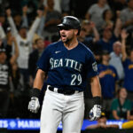 SEATTLE, WASHINGTON - AUGUST 09: Cal Raleigh #29 of the Seattle Mariners reacts after hitting a two-run home run during the eighth inning against the San Diego Padres at T-Mobile Park on August 09, 2023 in Seattle, Washington. (Photo by Alika Jenner/Getty Images)