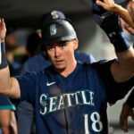 SEATTLE, WASHINGTON - AUGUST 09: Cade Marlowe #18 of the Seattle Mariners celebrates with teammates after scoring during the eighth inning against the San Diego Padres at T-Mobile Park on August 09, 2023 in Seattle, Washington. (Photo by Alika Jenner/Getty Images)
