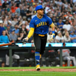 SEATTLE, WASHINGTON - AUGUST 11: Julio Rodriguez #44 of the Seattle Mariners tosses his bat after hitting a three-run home run during the fourth inning against the Baltimore Orioles at T-Mobile Park on August 11, 2023 in Seattle, Washington. (Photo by Alika Jenner/Getty Images)