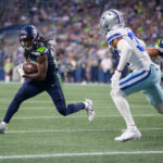 SEATTLE, WASHINGTON - AUGUST 19: SaRodorick Thompson Jr. #29 of the Seattle Seahawks runs for a touchdown against the Dallas Cowboys during a preseason game at Lumen Field on August 19, 2023 in Seattle, Washington. (Photo by Tom Hauck/Getty Images)