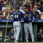 HOUSTON, TEXAS - AUGUST 18: Julio Rodriguez #44 of the Seattle Mariners receives congratulations from Teoscar Hernandez #35 after hitting a home run in the third inning against the Houston Astros at Minute Maid Park on August 18, 2023 in Houston, Texas. (Photo by Bob Levey/Getty Images)