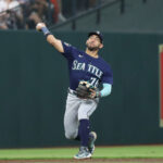 HOUSTON, TEXAS - AUGUST 18: Jose Caballero #76 of the Seattle Mariners throws out Jon Singleton #28 of the Houston Astros in the second inning at Minute Maid Park on August 18, 2023 in Houston, Texas. (Photo by Bob Levey/Getty Images)