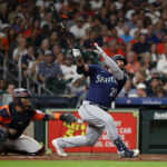 HOUSTON, TEXAS - AUGUST 18: Mike Ford #20 of the Seattle Mariners hits a home run in the sixth inning against the Houston Astros at Minute Maid Park on August 18, 2023 in Houston, Texas. (Photo by Bob Levey/Getty Images)