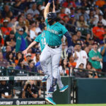 HOUSTON, TEXAS - AUGUST 20: Eugenio Suarez #28 of the Seattle Mariners hits a two-run home run in the second inning against the Houston Astros at Minute Maid Park on August 20, 2023 in Houston, Texas. (Photo by Bob Levey/Getty Images)