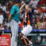HOUSTON, TEXAS - AUGUST 20: Yainer Diaz #21 of the Houston Astros makes a catch on a pop fly by Julio Rodriguez #44 of the Seattle Mariners in the fifth inning at Minute Maid Park on August 20, 2023 in Houston, Texas. (Photo by Bob Levey/Getty Images)