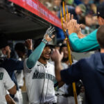SEATTLE, WA - AUGUST 28: Julio Rodriguez #44 of the Seattle Mariners celebrates in the dugout after hitting two-run home run off starting pitcher Kyle Muller #39 of the Oakland Athletics during the fourth inning of a game at T-Mobile Park on August 28, 2023 in Seattle, Washington. (Photo by Stephen Brashear/Getty Images)