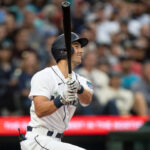 SEATTLE, WA - AUGUST 28: Dominic Canzone #8 of the Seattle Mariners hits a double off starting pitcher Kyle Muller #39 of the Oakland Athletics during the second inning at T-Mobile Park on August 28, 2023 in Seattle, Washington. (Photo by Stephen Brashear/Getty Images)