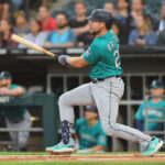 CHICAGO, ILLINOIS - AUGUST 21: Cal Raleigh #29 of the Seattle Mariners hits a two-run double against the Chicago White Sox during the first inning at Guaranteed Rate Field on August 21, 2023 in Chicago, Illinois. (Photo by Michael Reaves/Getty Images)